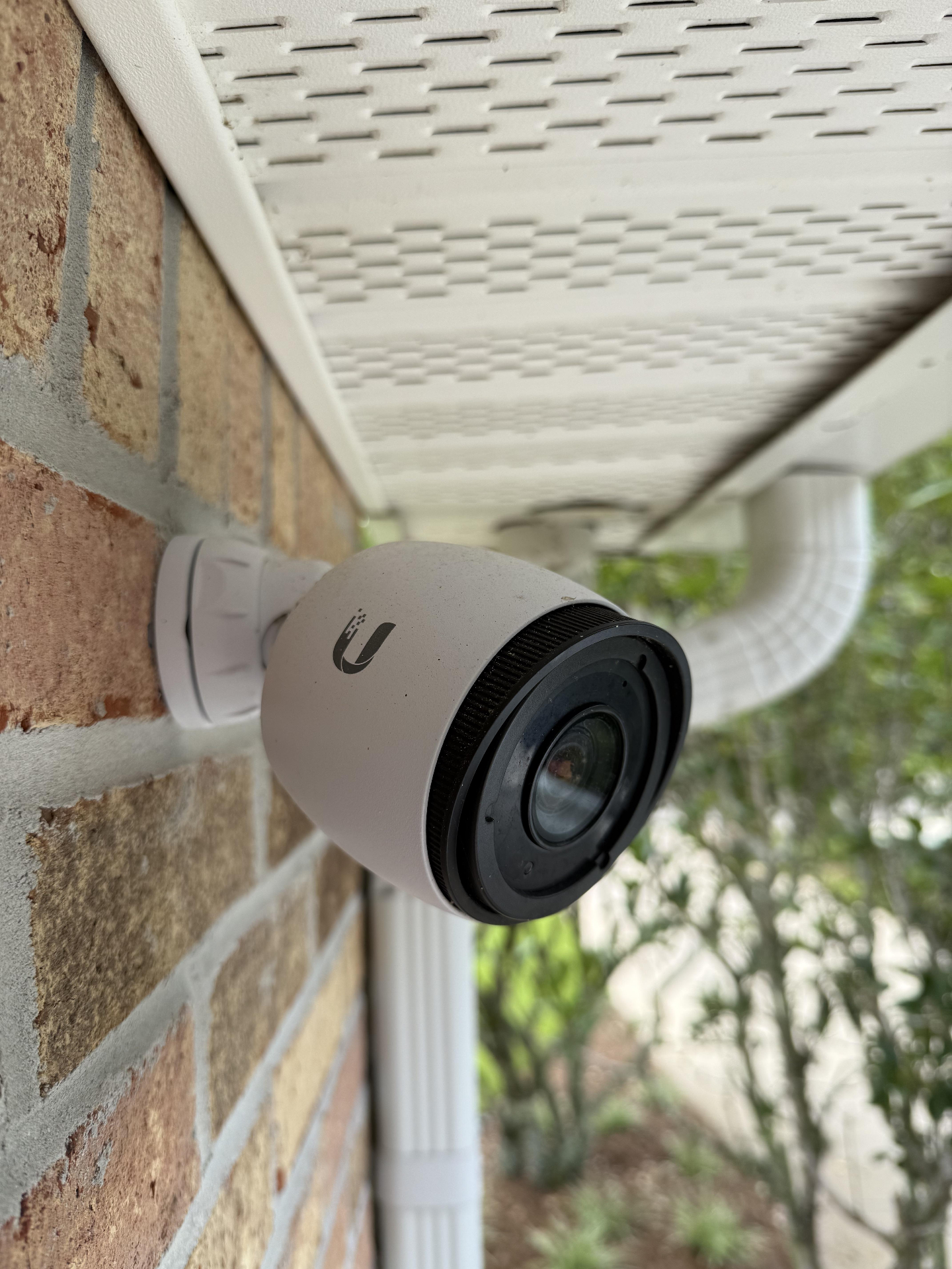 Ubiquiti UniFi Protect G5 Bullet camera mounted under a brick soffit with a clean weather-boot cable entry, installed by Access Cabling.