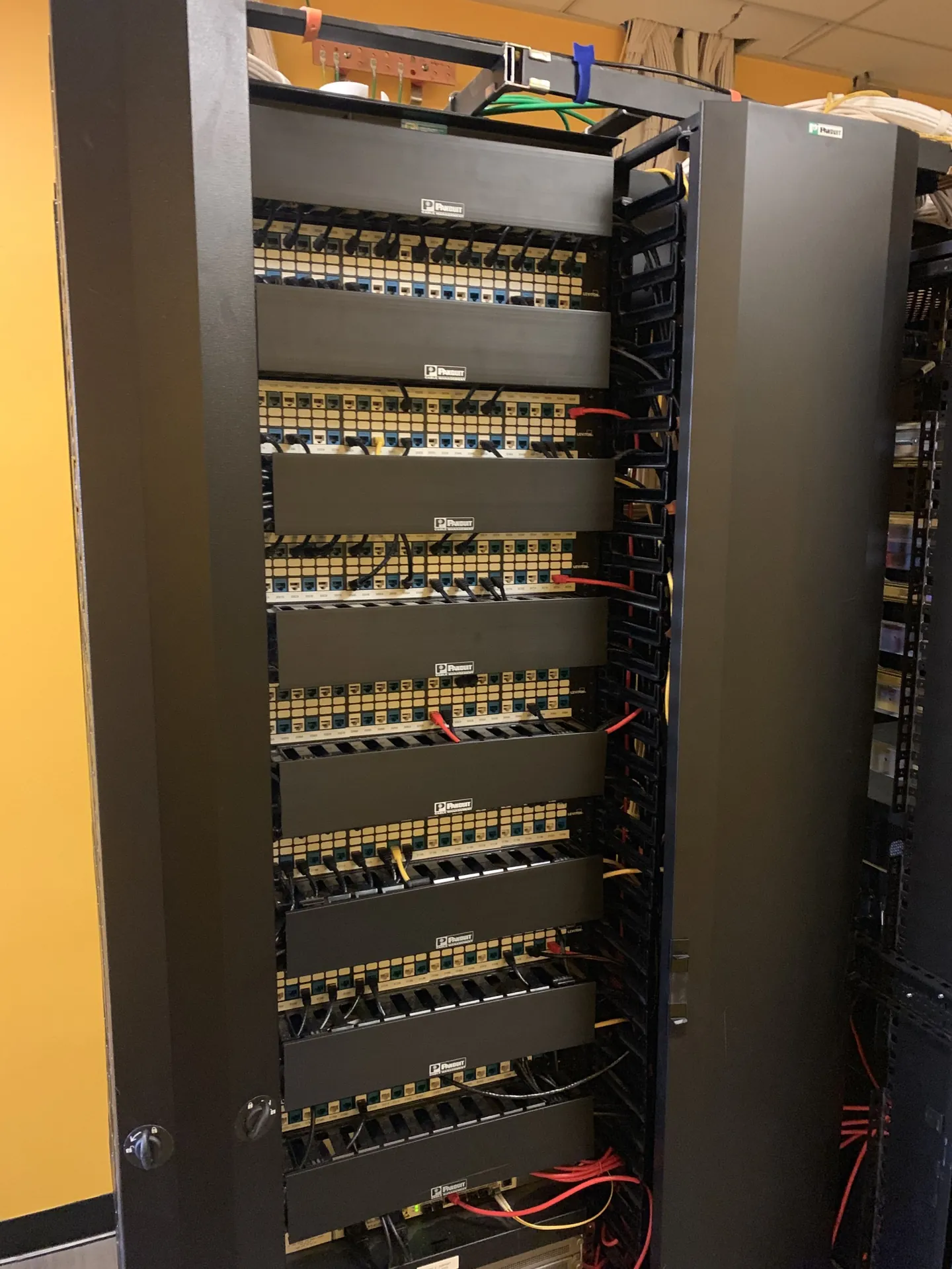 Full-height Panduit rack with Leviton patch panels ready for Fluke DSX channel certification.